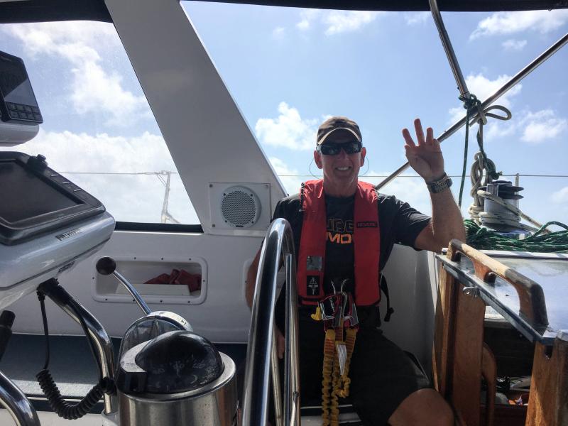 man waving on boat