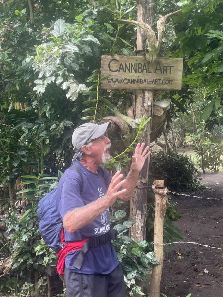 Andy in Front of Sign in Hakatea Bay